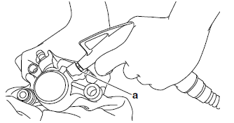 Disassembling the rear brake caliper